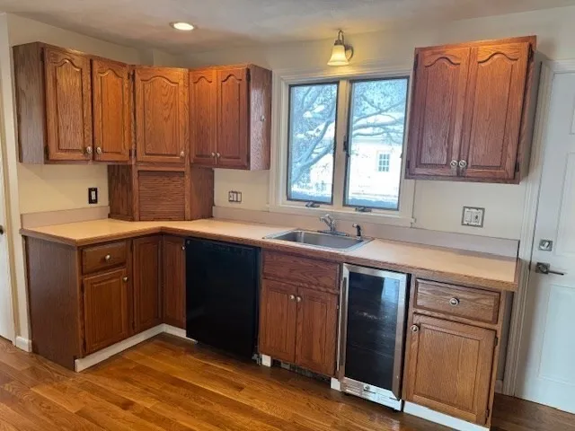 a kitchen with a sink cabinets and window