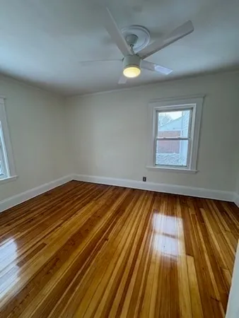 a view of wooden floor and brick walls