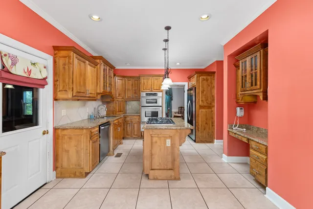 a kitchen with a stove and a refrigerator