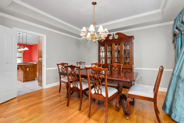 a view of empty room with wooden floor and fireplace