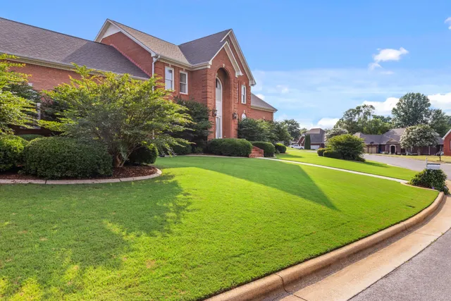 a view of a big building with a big yard