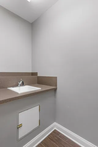 a view of a chairs and table in a backyard