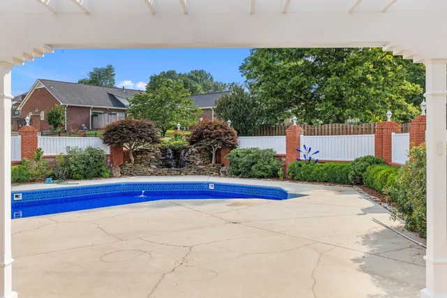 an aerial view of a house with a garden