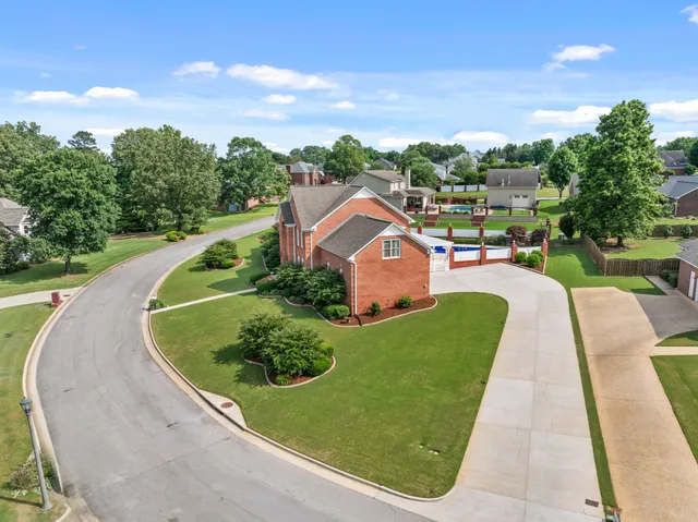 an aerial view of a house with outdoor space patio and mountain view