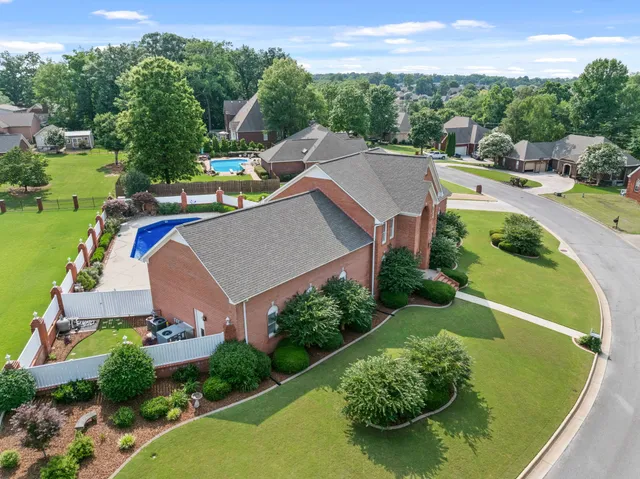 an aerial view of a house with a garden