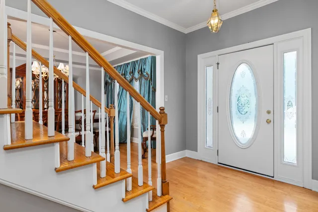 a view of entryway with wooden floor