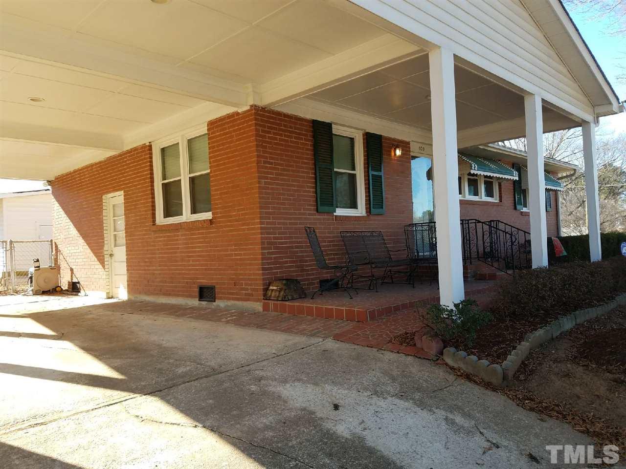 800 Newcombe Road Raleigh, NC 27610 - Photo 1 of 14 a view of a house with a backyard