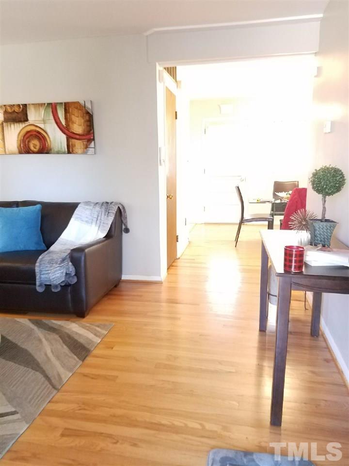 800 Newcombe Road Raleigh, NC 27610 - Photo 11 of 14 a living room with furniture and wooden floor