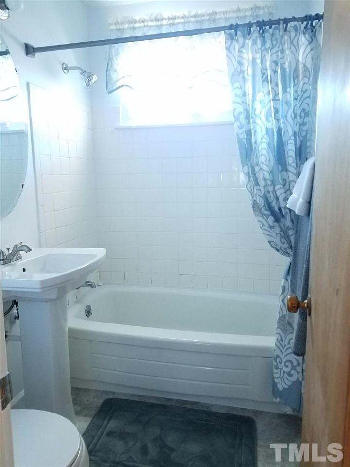 800 Newcombe Road Raleigh, NC 27610 - Photo 13 of 14 a bathroom with a sink and a toilet
