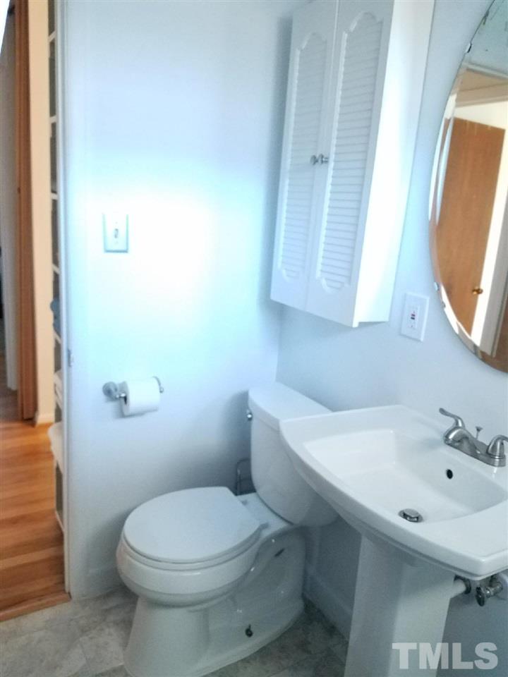 800 Newcombe Road Raleigh, NC 27610 - Photo 14 of 14 a bathroom with a sink a toilet and mirror