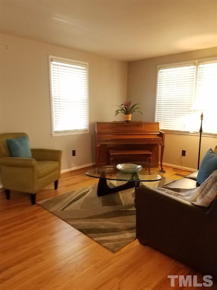 800 Newcombe Road Raleigh, NC 27610 - Photo 7 of 14 a living room with furniture and window