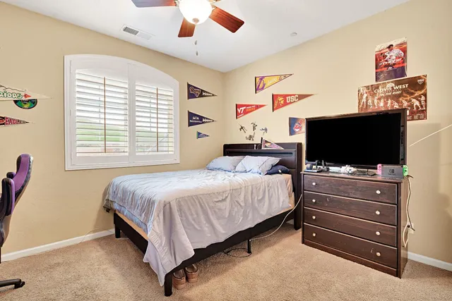 a front view of a house with a yard table and chairs