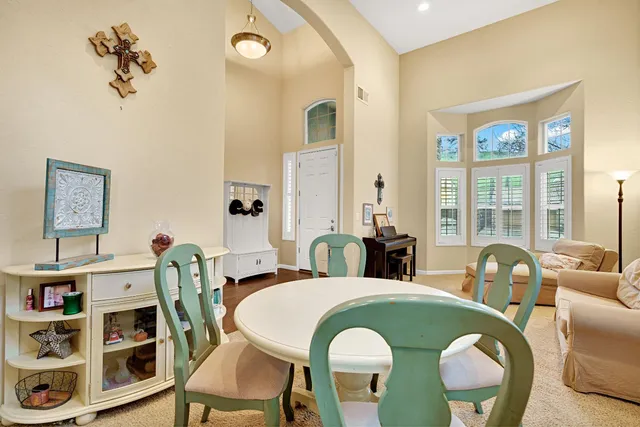 a dining room with furniture and window