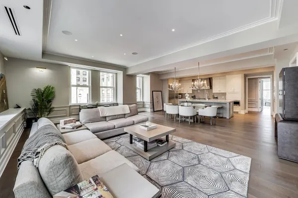 a view of living room kitchen and dining room