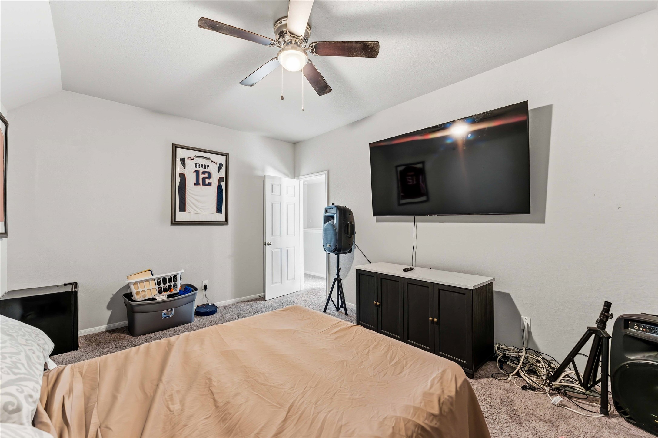 14810 Ruddy Duck Lane Houston, TX 77049 - Photo 28 of 33 a bedroom with a bed and a flat screen tv