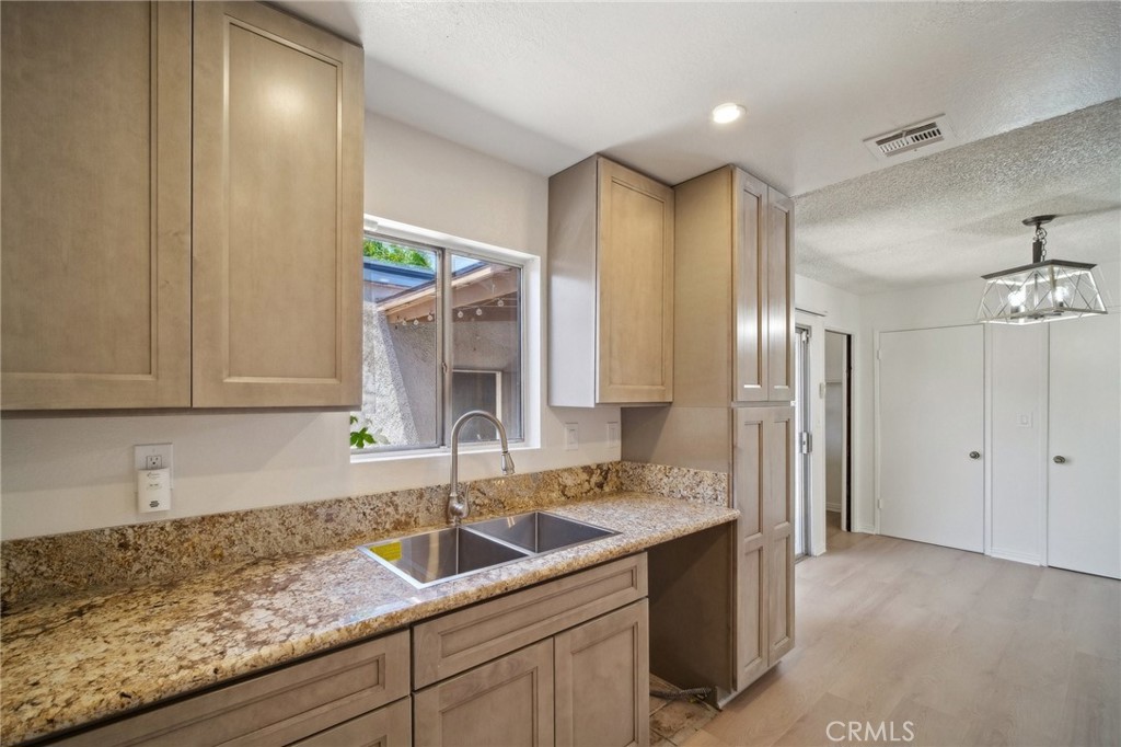 1926 Lucas Street, Unit 2 San Fernando, CA 91340 - Photo 13 of 35 a kitchen with a sink and cabinets