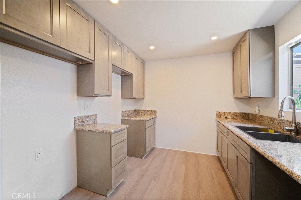 1926 Lucas Street, Unit 2 San Fernando, CA 91340 - Photo 14 of 35 a kitchen with stainless steel appliances granite countertop a sink stove and refrigerator