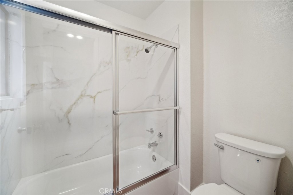1926 Lucas Street, Unit 2 San Fernando, CA 91340 - Photo 22 of 35 a bathroom with a shower and a toilet