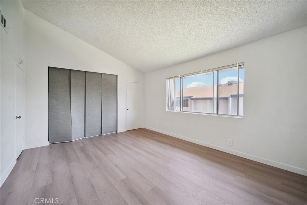 1926 Lucas Street, Unit 2 San Fernando, CA 91340 - Photo 27 of 35 a view of an empty room with wooden floor and a window