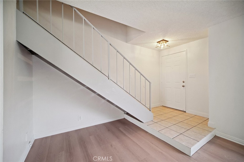 1926 Lucas Street, Unit 2 San Fernando, CA 91340 - Photo 3 of 35 a view of an entryway with wooden floor