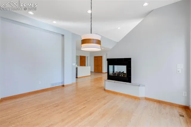 a room with window and fireplace