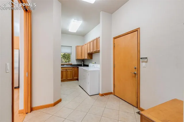 a kitchen with a refrigerator and a stove
