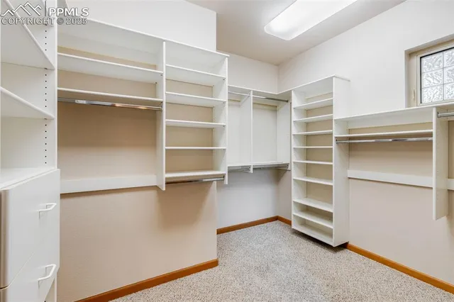 a view of an empty walk in closet
