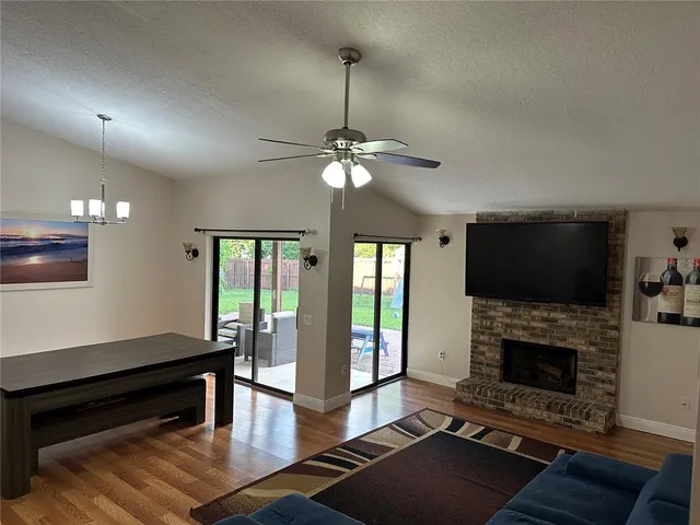 a living room with furniture fireplace and flat screen tv
