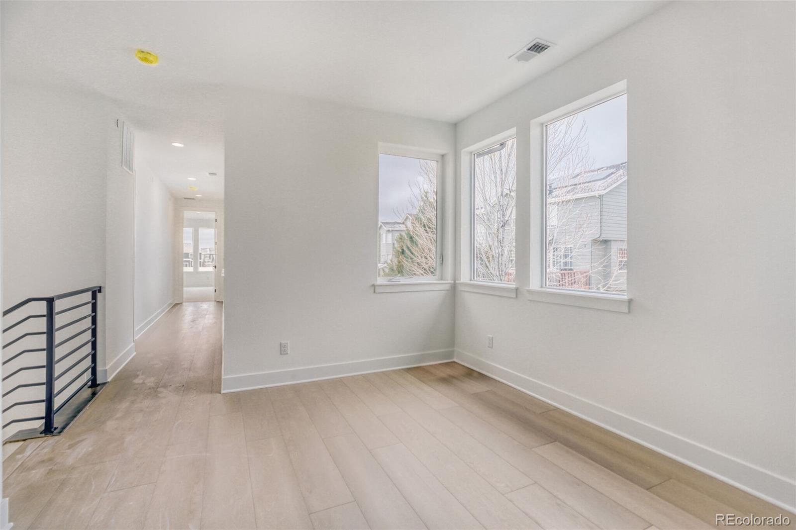 672 Apex Street Erie, CO 80516 - Photo 7 of 19 an empty room with windows
