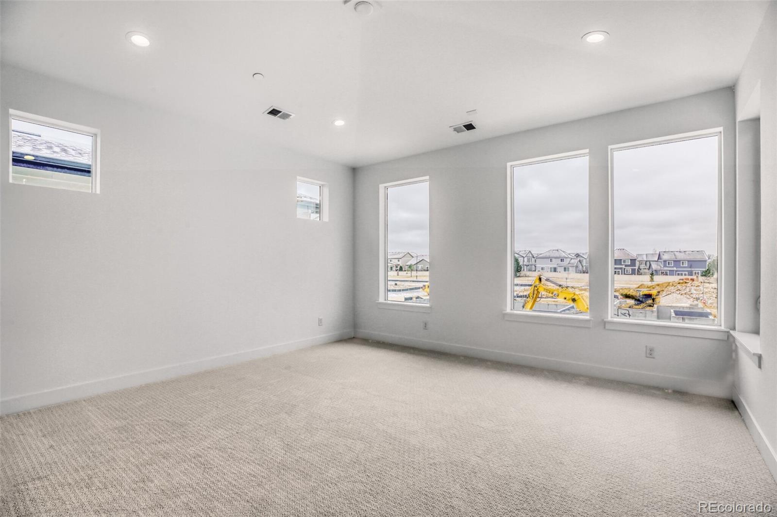 672 Apex Street Erie, CO 80516 - Photo 8 of 19 an empty room with windows