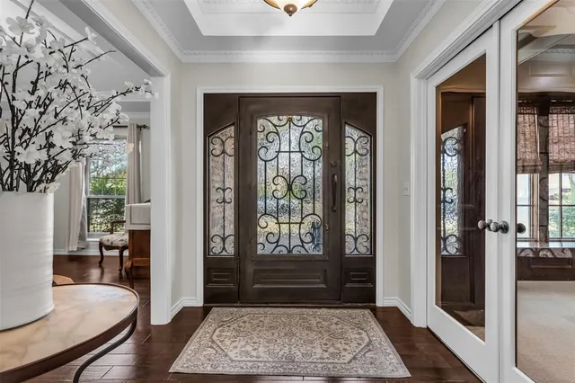 a living room with a rug and a window