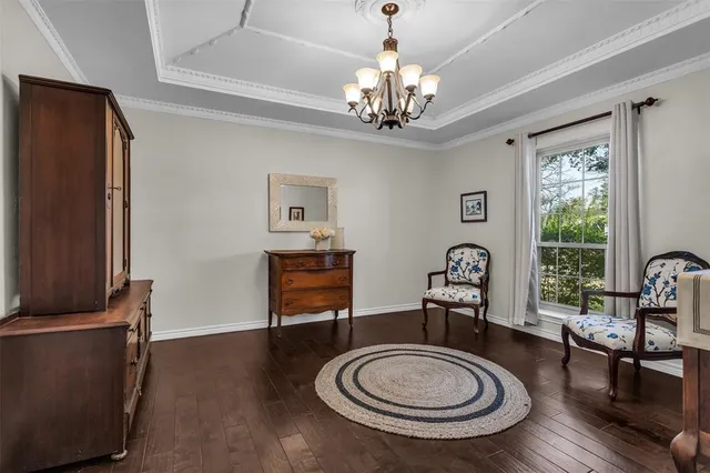 a view of a livingroom with furniture window and wooden floor
