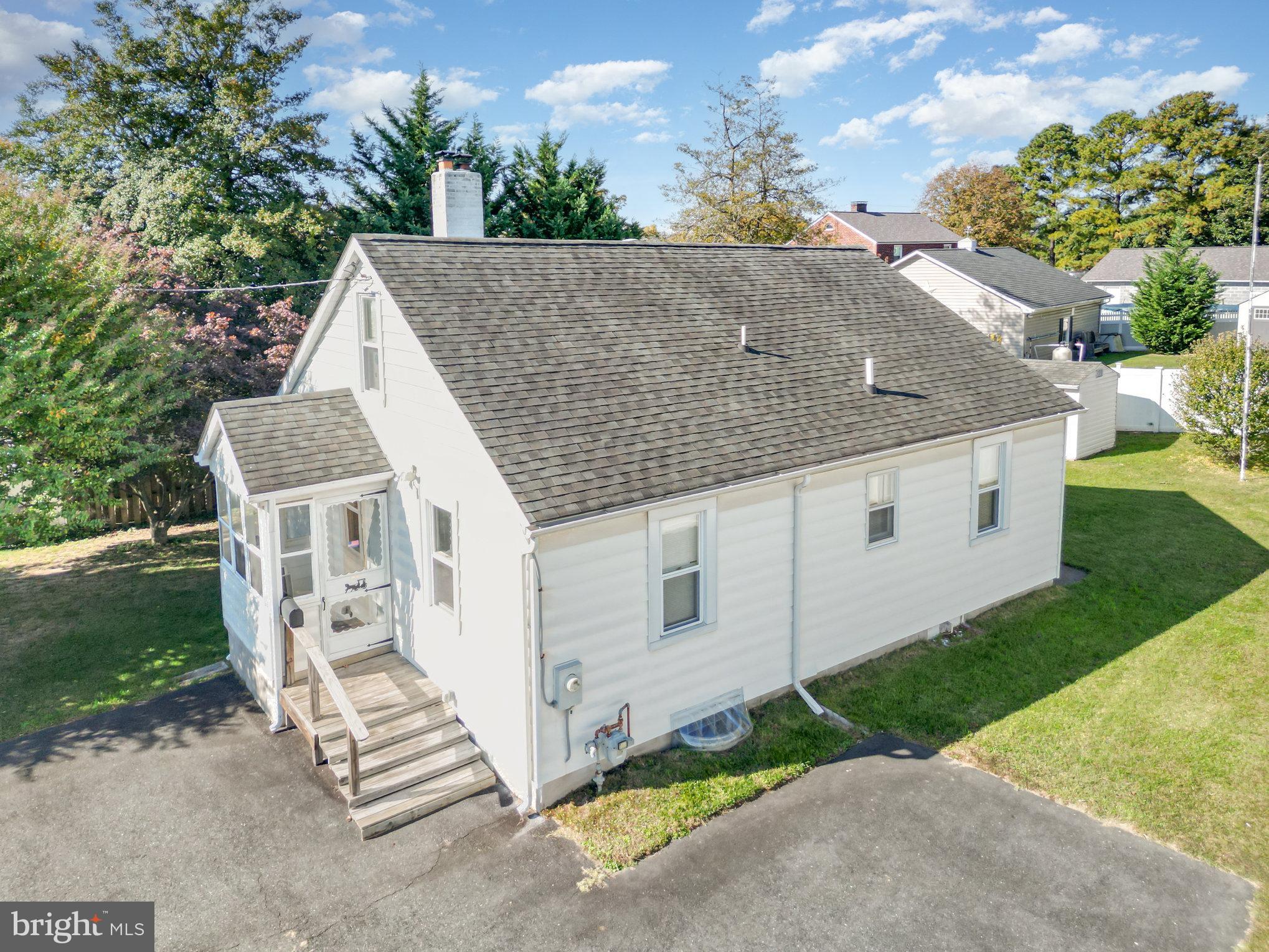 a aerial view of a house with a yard