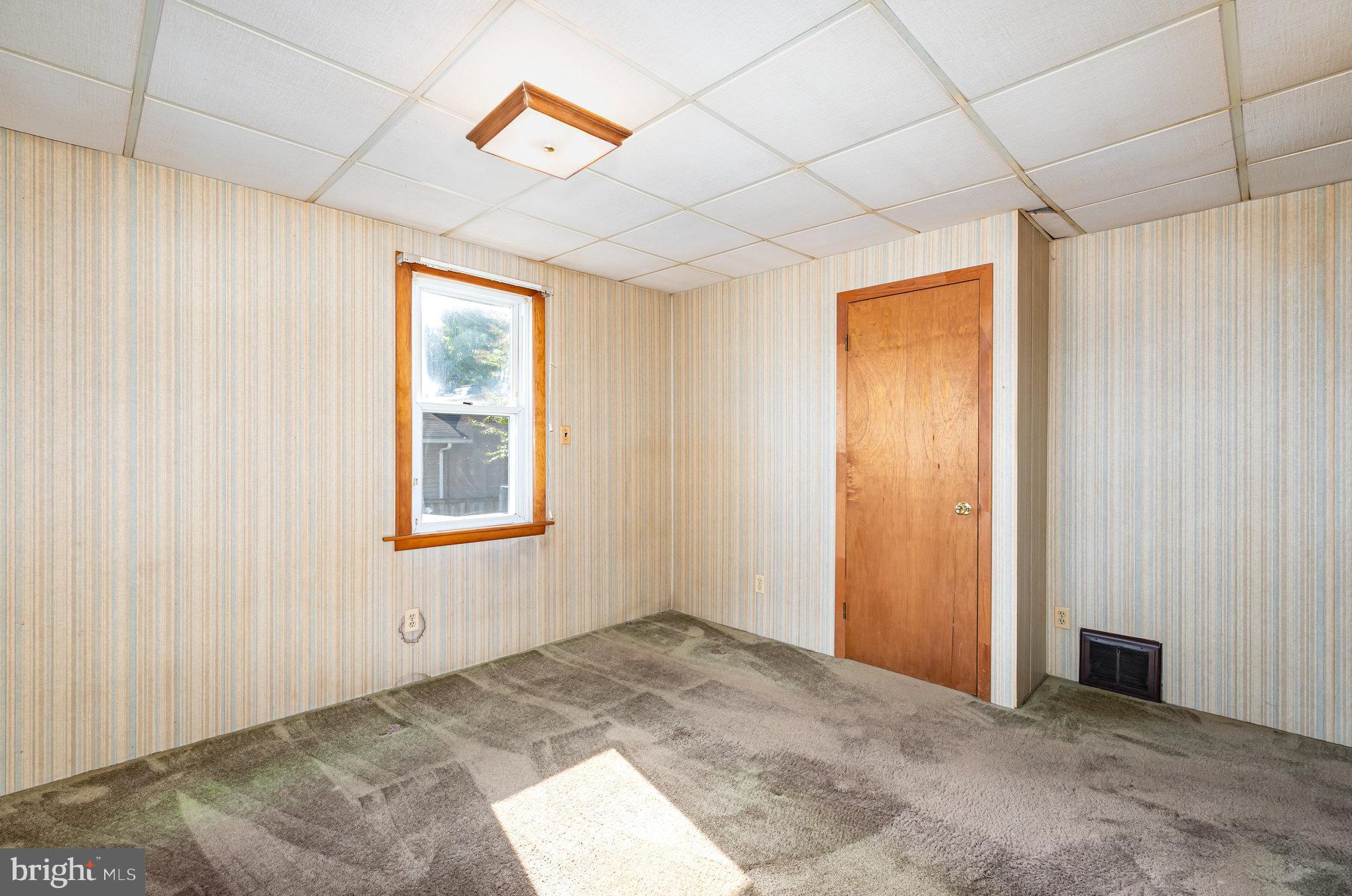 1940 Robinwood Road Baltimore, MD 21222 - Photo 12 of 36 an empty room with windows