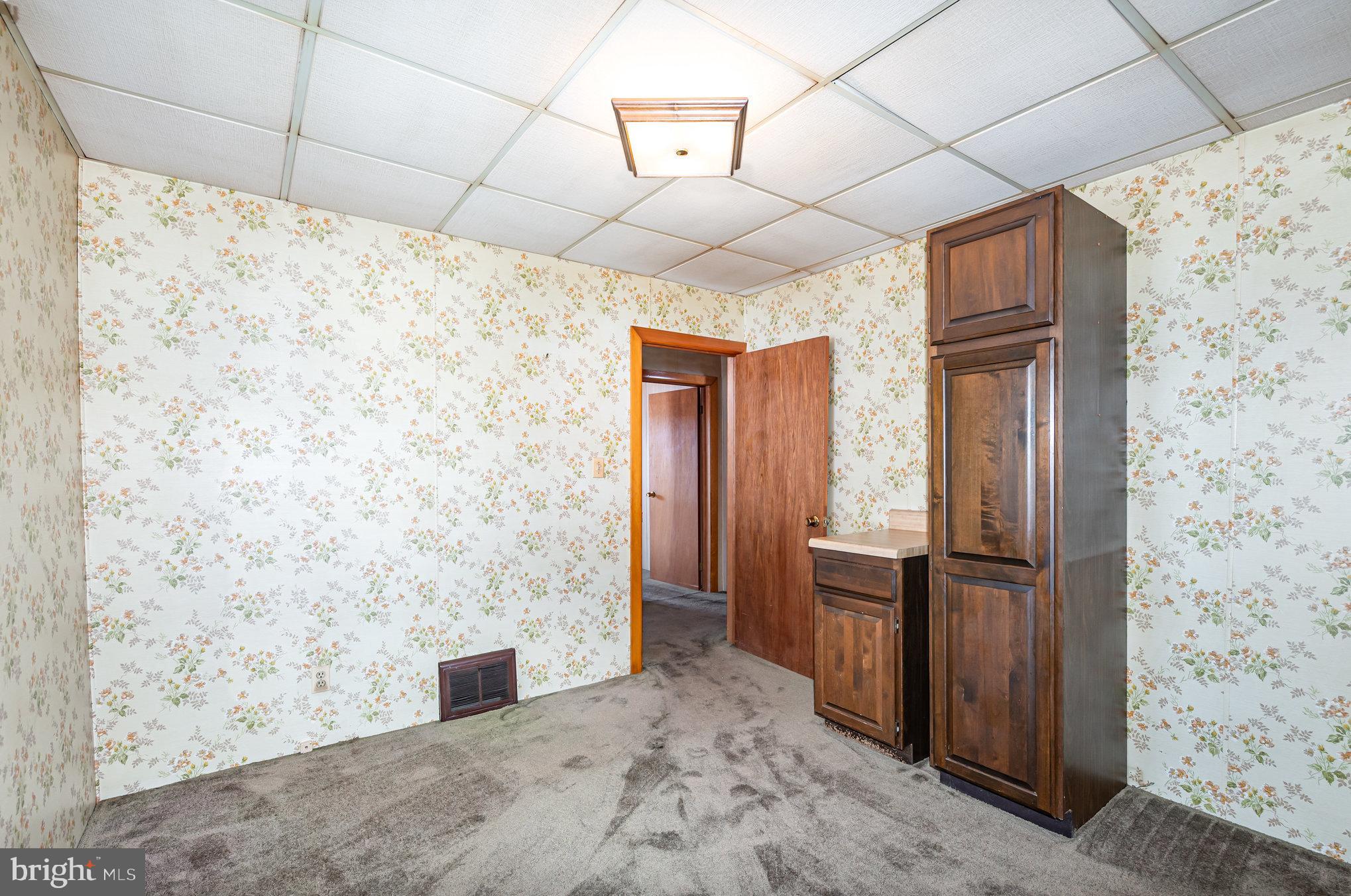 1940 Robinwood Road Baltimore, MD 21222 - Photo 16 of 36 a view of a refrigerator in kitchen and wooden floor