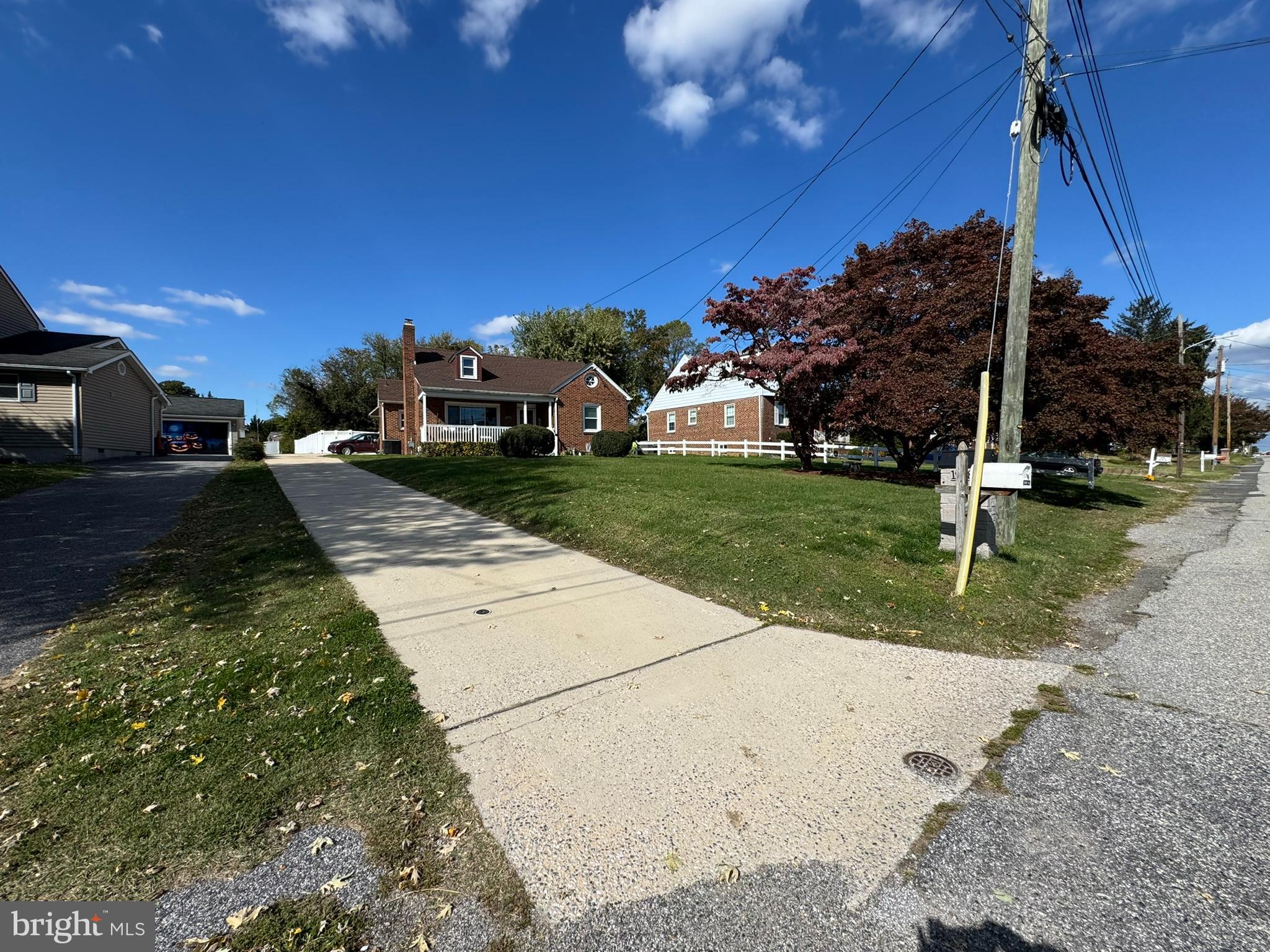 1940 Robinwood Road Baltimore, MD 21222 - Photo 35 of 36 a view of a yard with cars parked