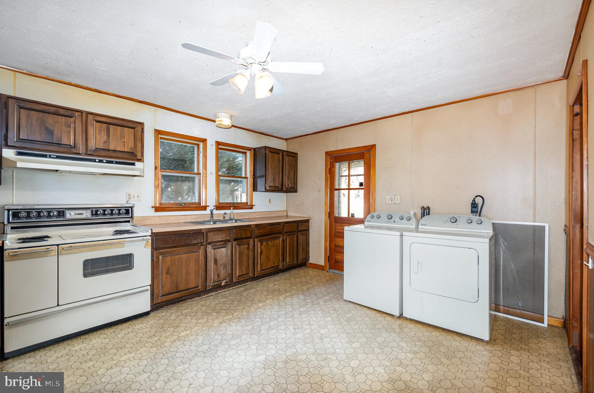 1940 Robinwood Road Baltimore, MD 21222 - Photo 4 of 36 a kitchen with a stove and a sink