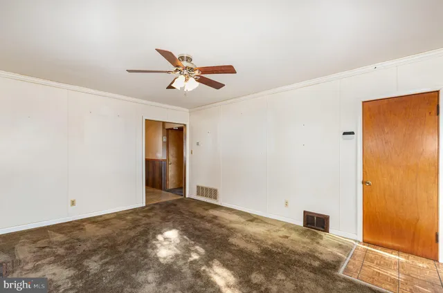 a view of a big room with carpet