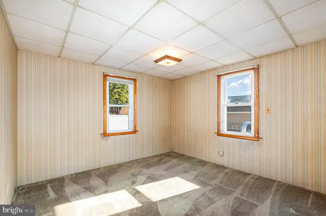 an empty room with windows