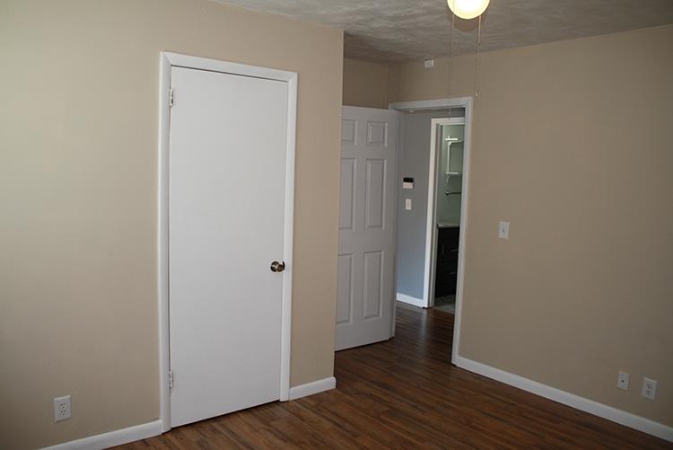 267 Raintree Drive Clarksville, TN 37042 - Photo 7 of 10 a view of a hallway with wooden floor
