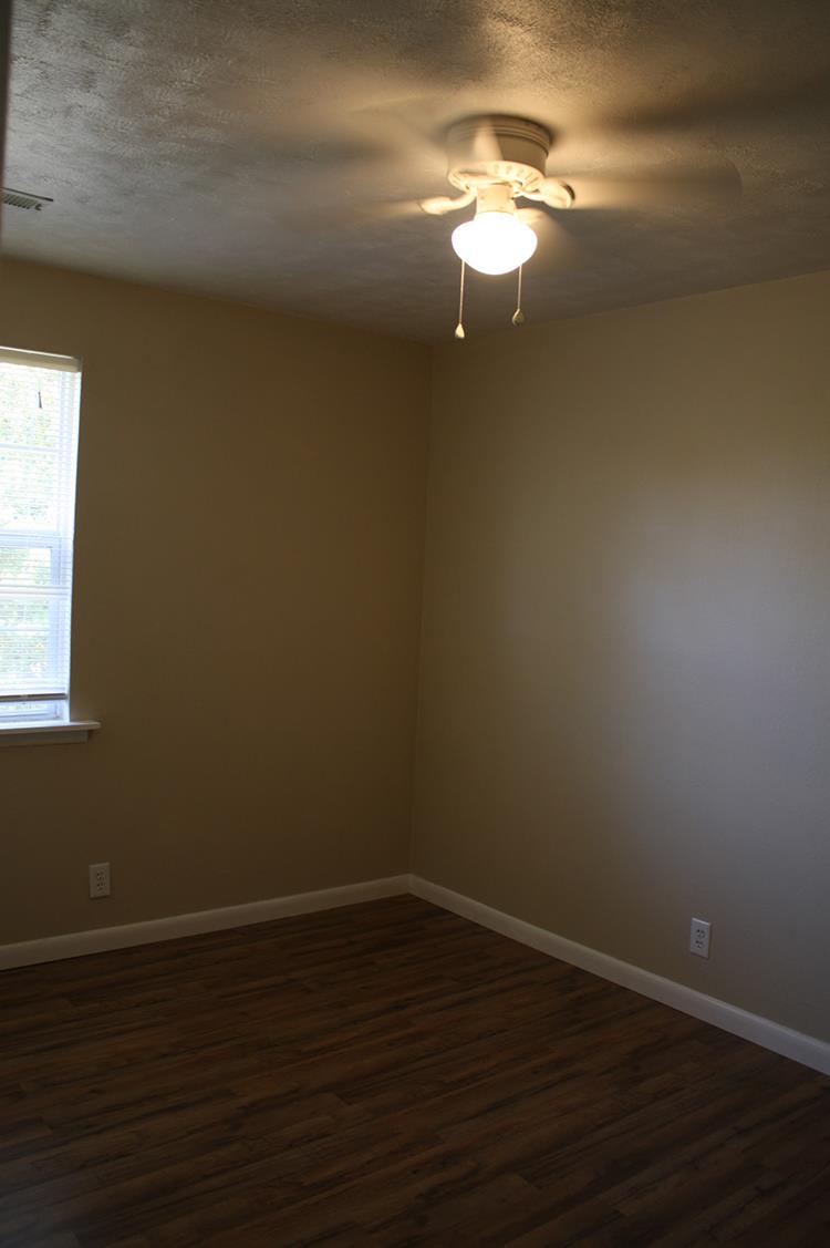 267 Raintree Drive Clarksville, TN 37042 - Photo 8 of 10 a view of a room with wooden floor and windows