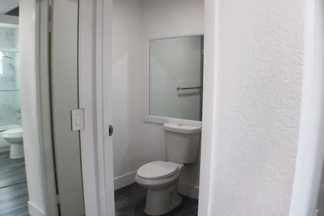 a bathroom with a toilet and a sink