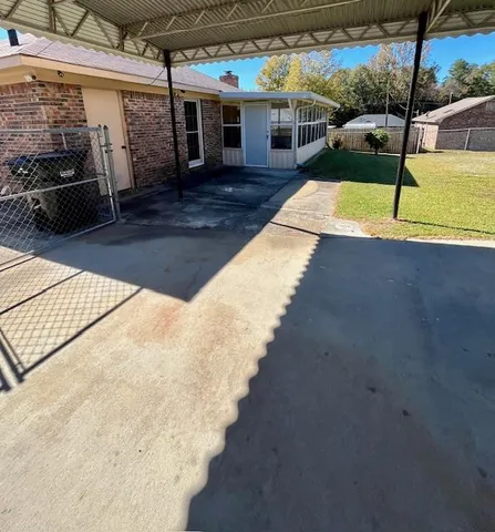 a view of a swimming pool with a yard