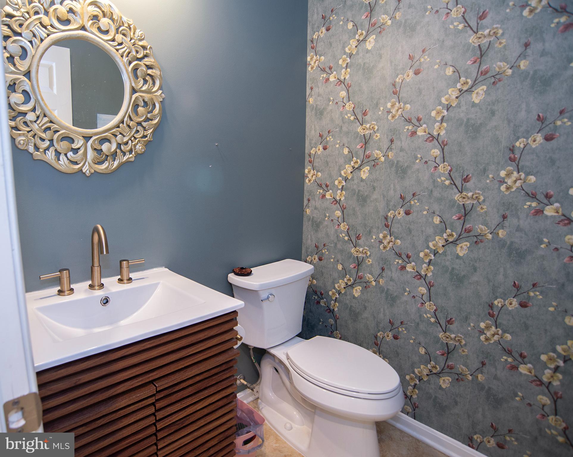 20 Aster Lane Stafford, VA 22554 - Photo 19 of 57 a bathroom with a sink a toilet and a mirror