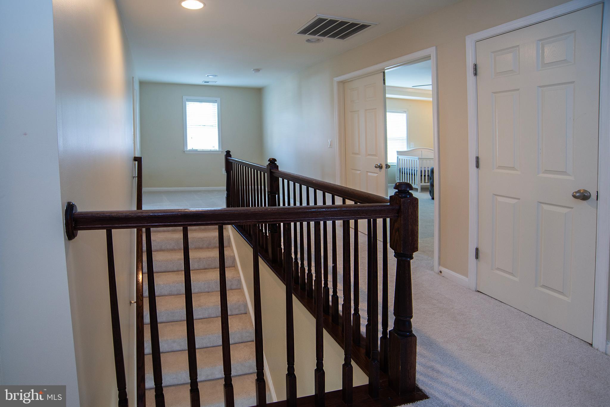 20 Aster Lane Stafford, VA 22554 - Photo 21 of 57 a view of a balcony with wooden floor and stairs