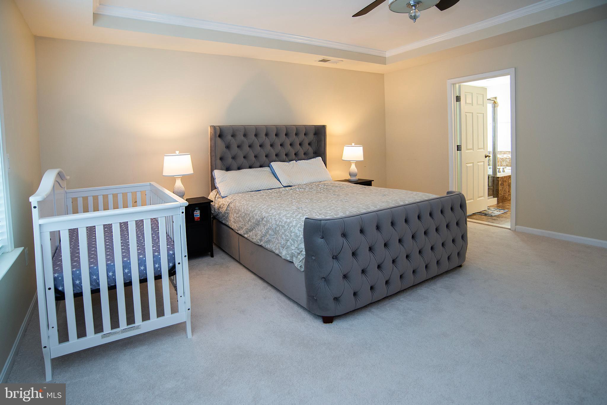 20 Aster Lane Stafford, VA 22554 - Photo 23 of 57 a bedroom with a bed and a dresser