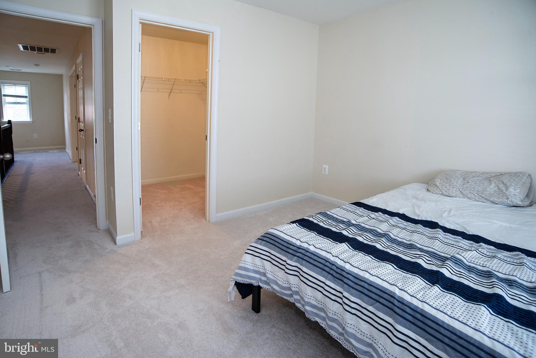 20 Aster Lane Stafford, VA 22554 - Photo 29 of 57 a bedroom with a bed and a cabinets