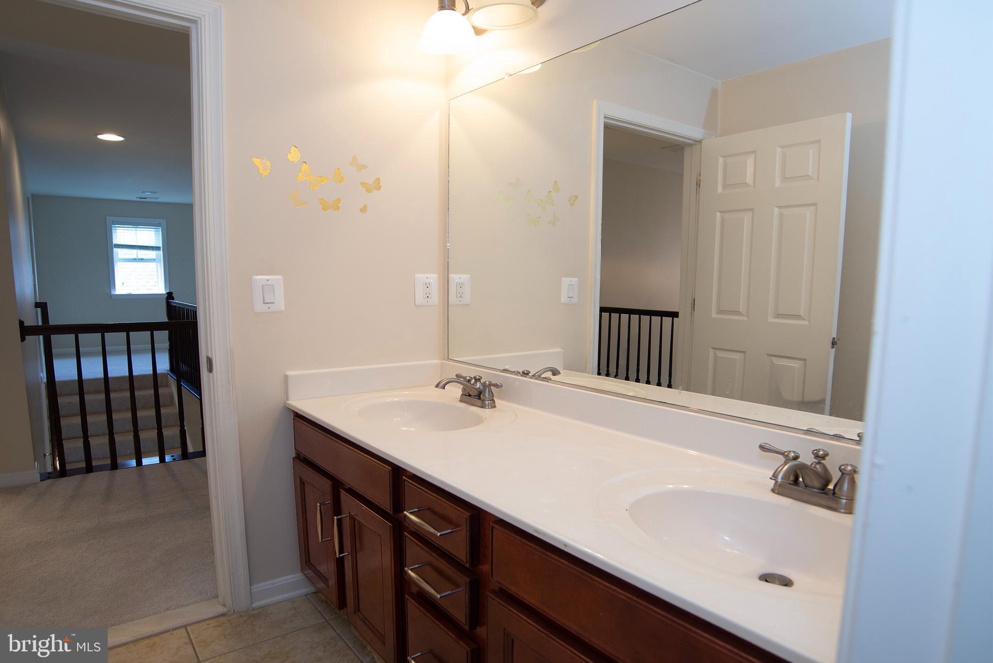 20 Aster Lane Stafford, VA 22554 - Photo 35 of 57 a bathroom with a sink double vanity and a mirror
