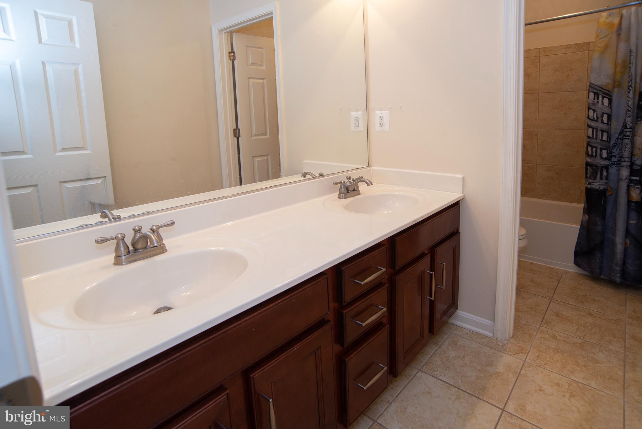 20 Aster Lane Stafford, VA 22554 - Photo 36 of 57 a bathroom with a double vanity sink and a mirror