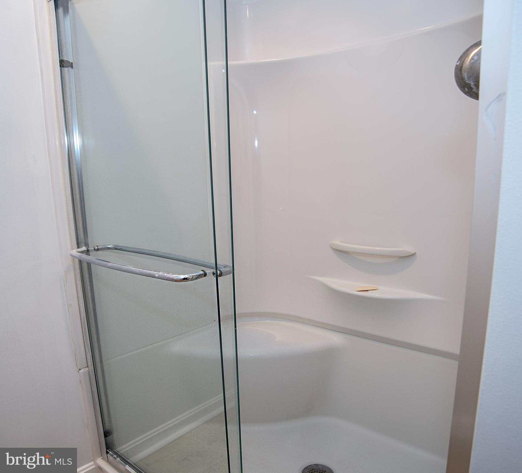 20 Aster Lane Stafford, VA 22554 - Photo 39 of 57 a bathroom with a glass shower door